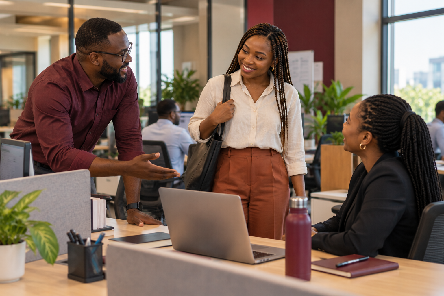 Colleagues welcoming a new team member to a prepared workstation in Nairobi